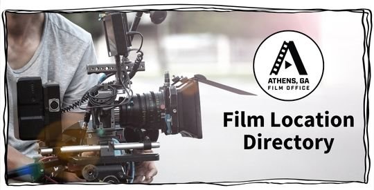 Camera operator adjusting a film camera 