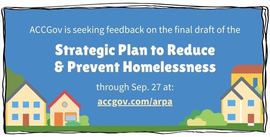 Graphic tan houses on green grass in front of a blue background.