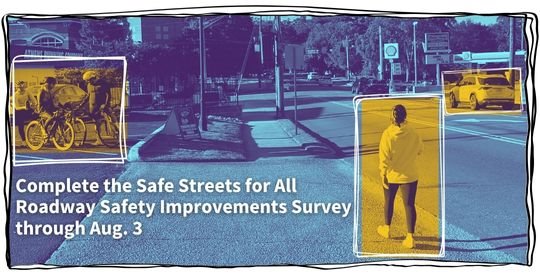 Street scene showing cyclists, a pedestrian, and an automobile