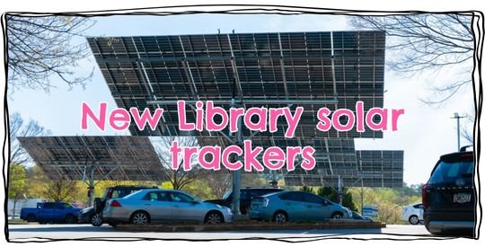 Cars parked underneath the large solar arrays in the ACC Library parking lot