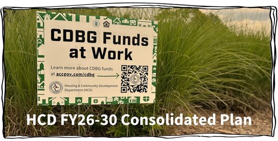 A yard sign in front of tall green grass