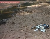 A photo of a pile of trash along the Middle Oconee River taken by Alexander Martin.