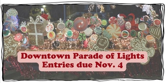 A Christmas parade float with text in front