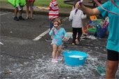 A 2022 Athens Water Festival attendee at an activity booth.