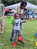 A 2022 Athens Water Festival attendee at an activity booth.
