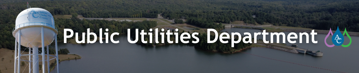 Public Utilities Department. Athens-Clarke County Outdoor Water Tower. Lake in background.