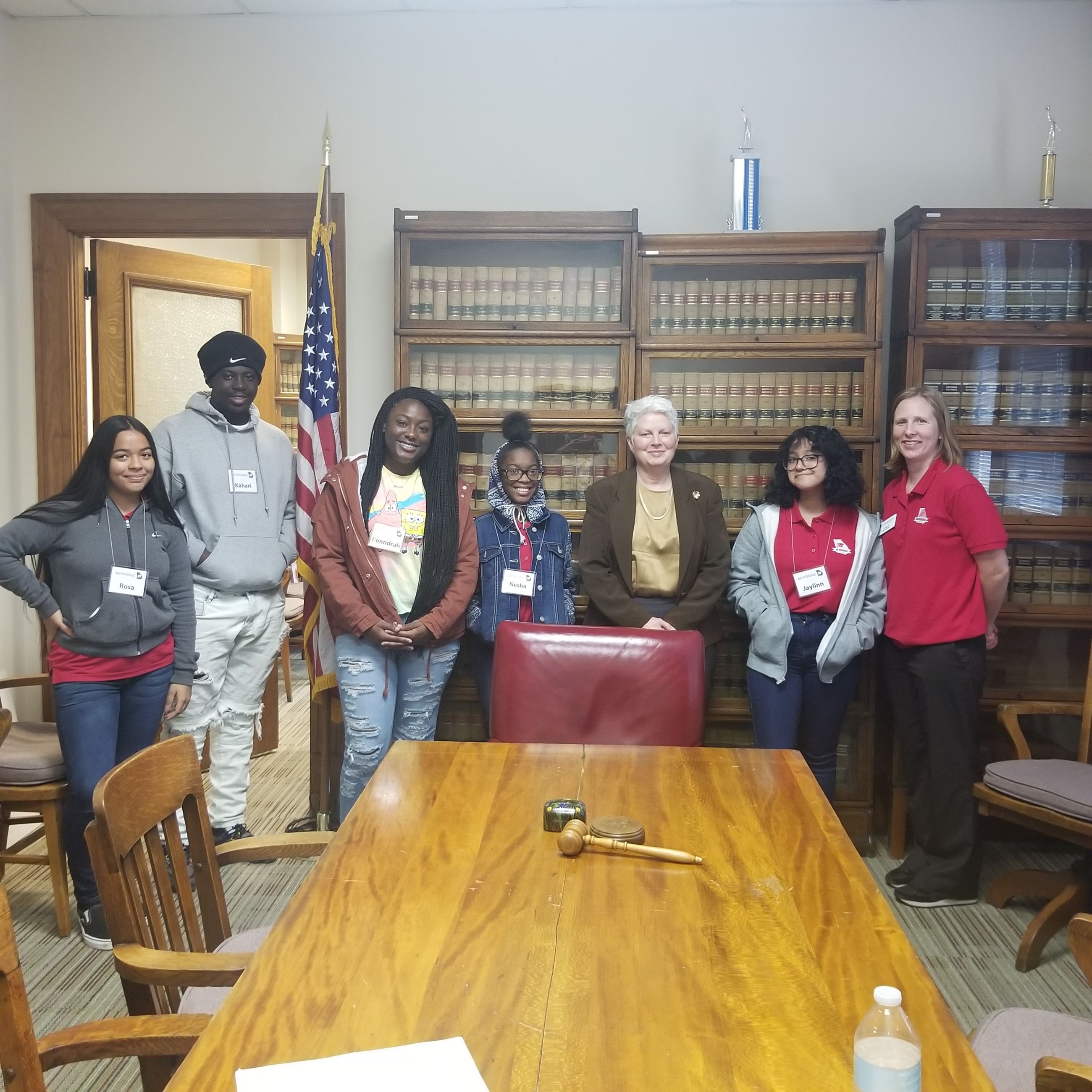 Susan Schaffer standing with students from GA Possible